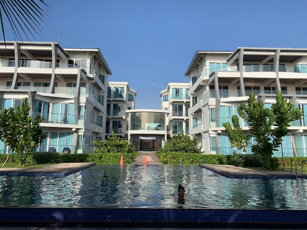 Swimming pool and apartment buildings at 123 Ocean Front Condo