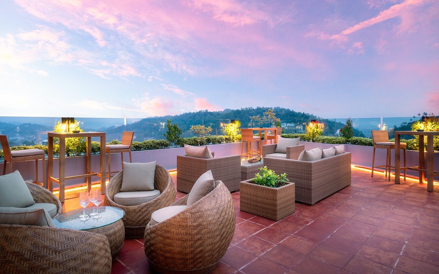 Grand Sky Lounge rooftop at dusk — terrace lights and Kandy hills while sky still holds colour
